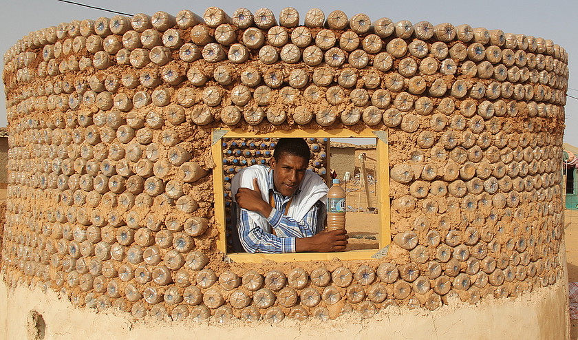 Refugee Recycle Plastic Bottles To Build Houses